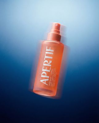 a bottle of apricot on a blue background