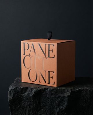 a box with a bird sitting on top of it