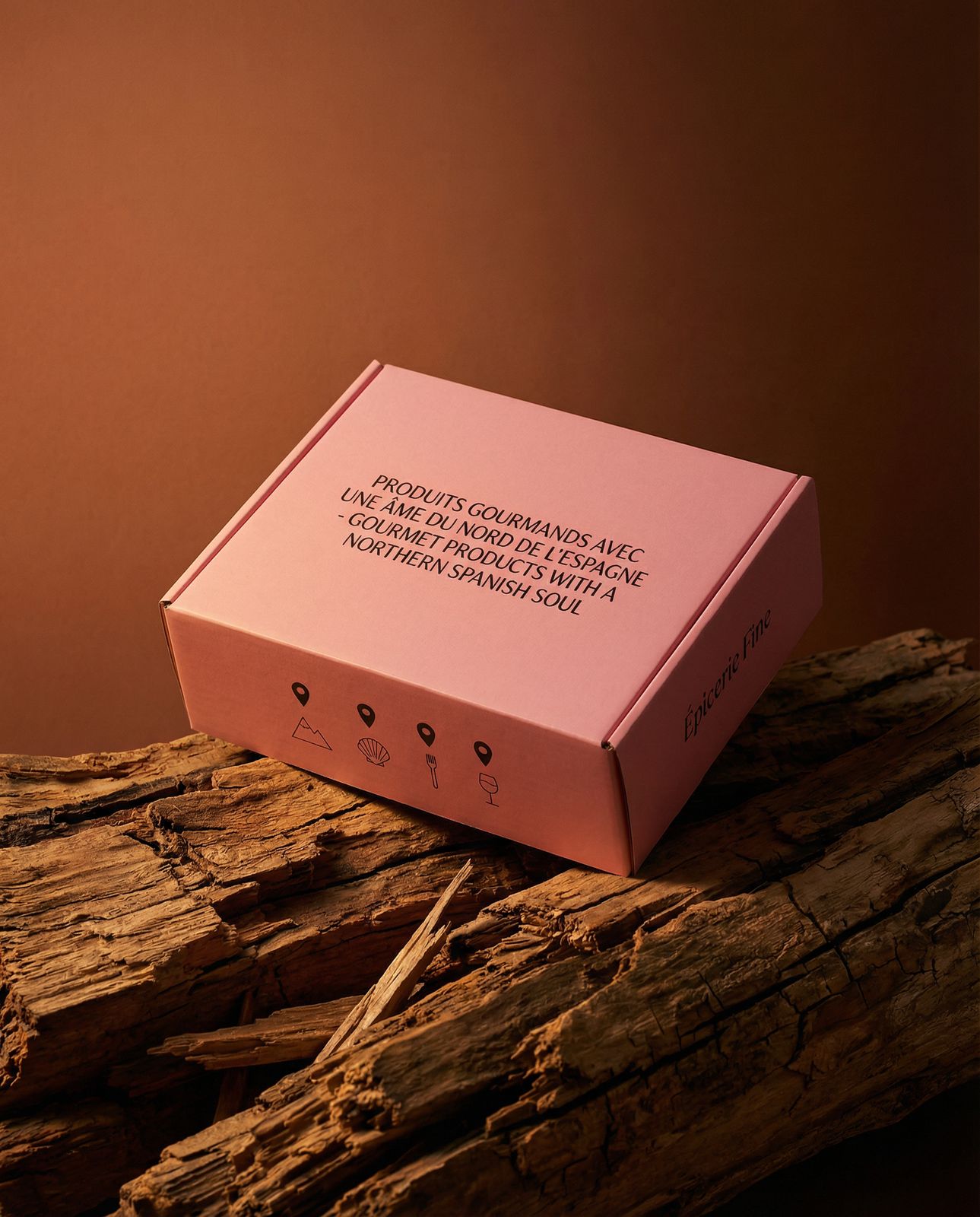 a pink box sitting on top of a piece of wood