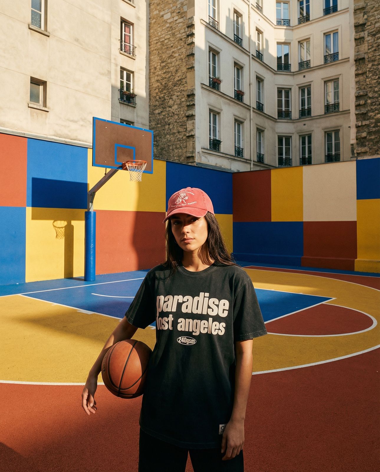 a woman standing in front of a basketball court