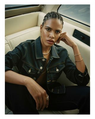 a woman sitting in the back of a car