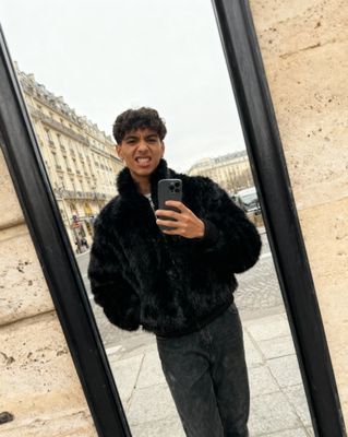 a man taking a selfie in front of a mirror