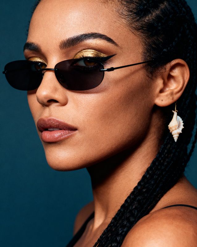 a woman wearing a pair of black sunglasses