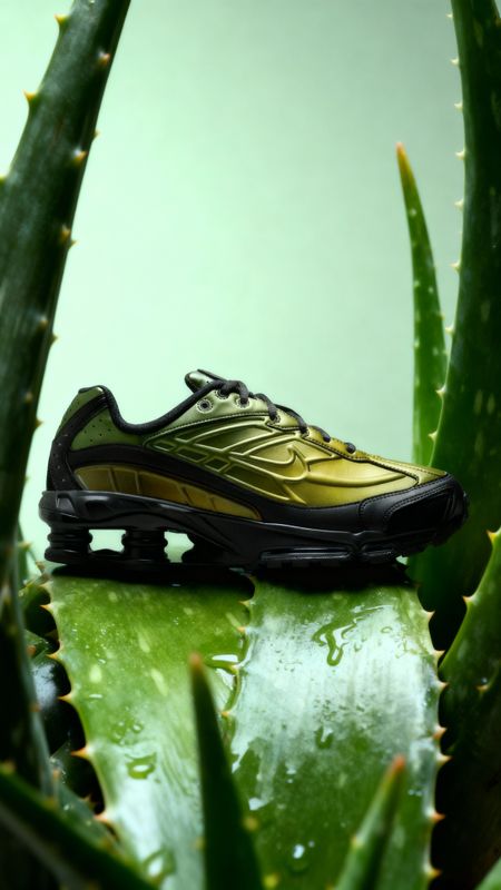 a close up of a shoe on top of a plant