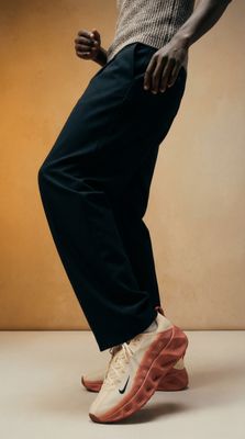 a man standing on top of a pair of shoes