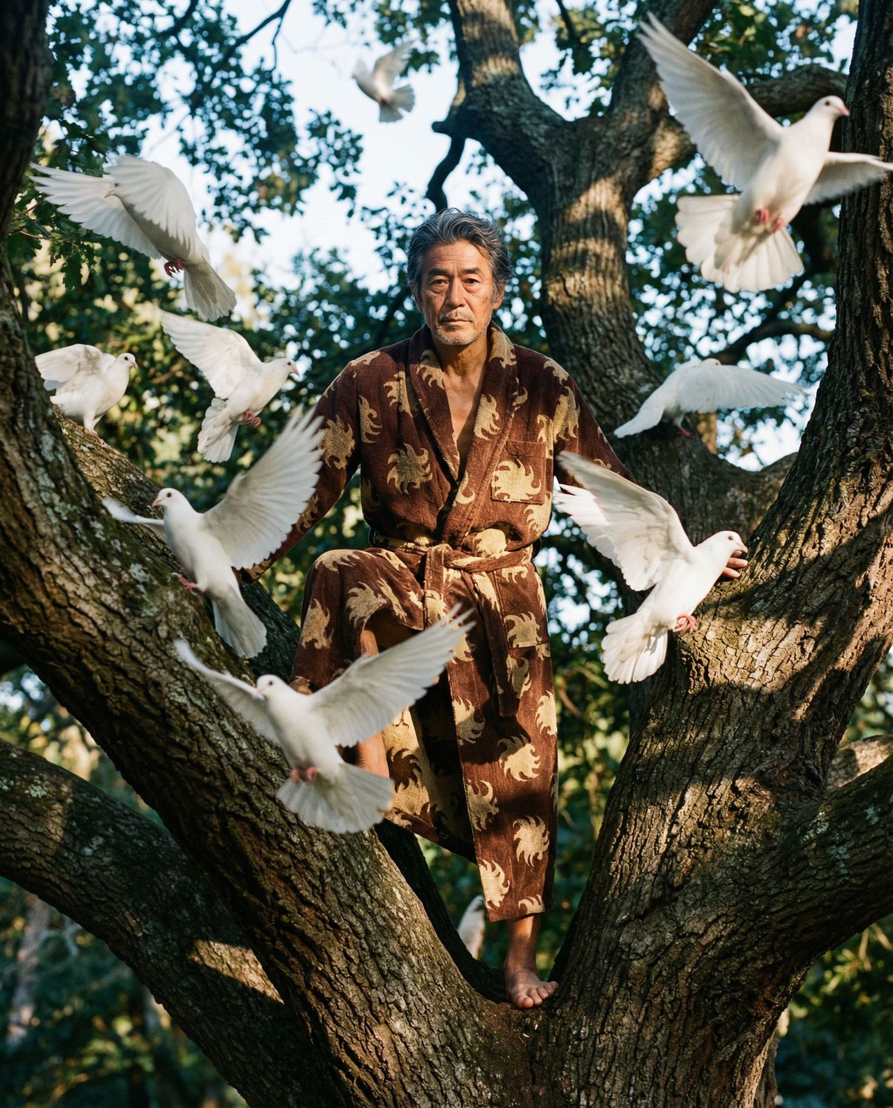 a man sitting in a tree surrounded by white birds