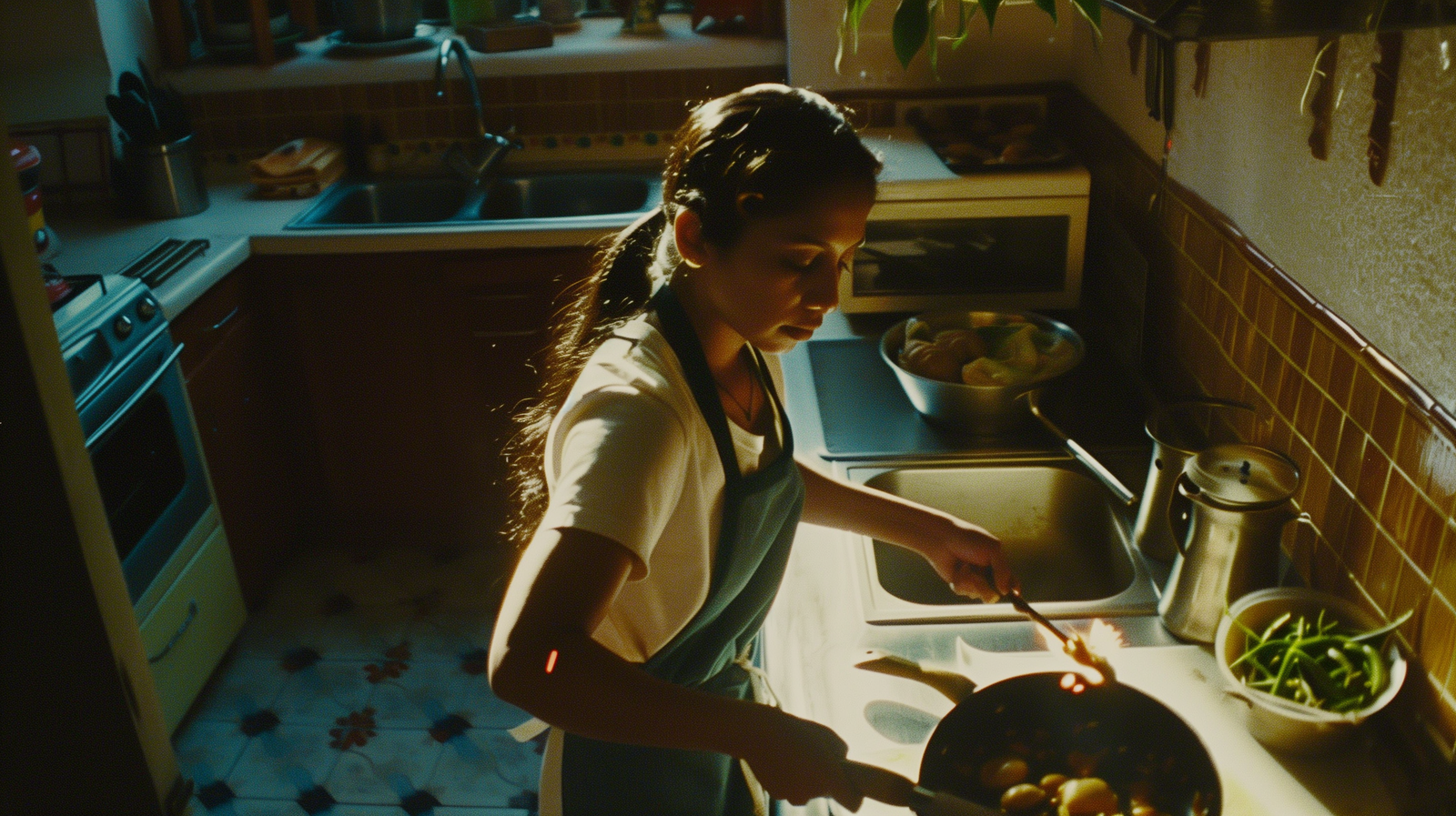 a woman cooking in a kitchen with a skillet