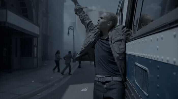 a man leaning out the window of a bus