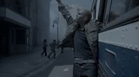 a man leaning out the window of a bus