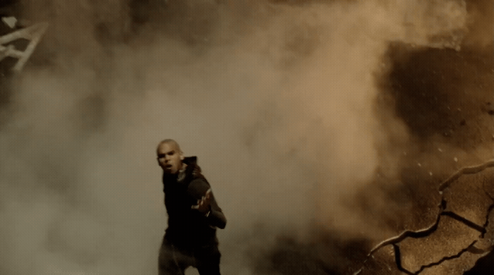 a man standing in the middle of a cloud of smoke