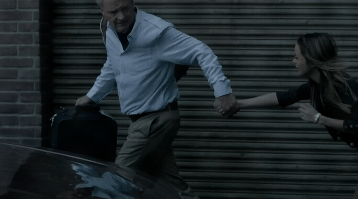 a man and a woman are holding hands