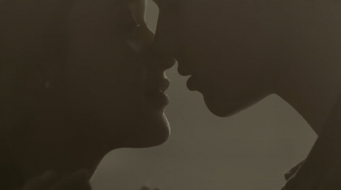 a couple of people that are kissing each other