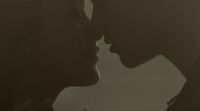 a couple of people that are kissing each other