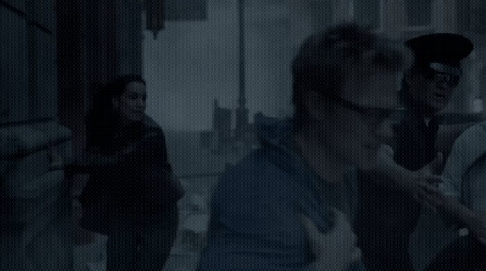 a group of people walking down a street