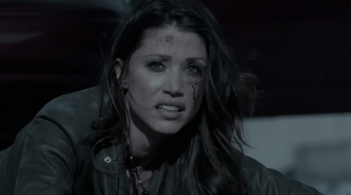 a woman in a black leather jacket and piercings