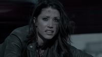 a woman in a black leather jacket and piercings