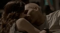 a man kissing a woman on the cheek