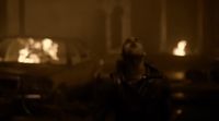 a blurry image of a man standing in front of a car
