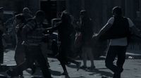 a group of people walking down a street