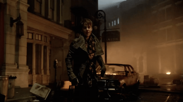 a man standing on a city street at night