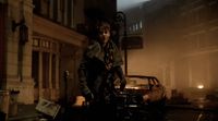 a man standing on a city street at night