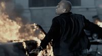 a man standing in front of a bunch of fire