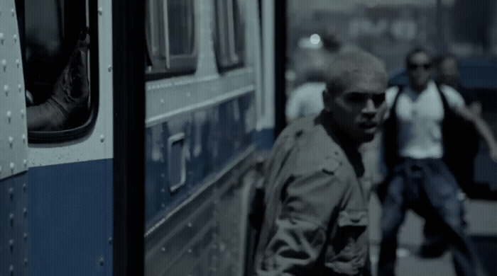 a man walking next to a bus on a street