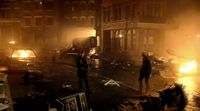 a couple of people standing in the middle of a street