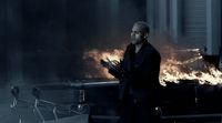 a man standing in front of a fire