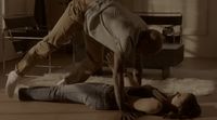 two people doing a handstand on the floor