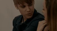 a boy and a girl looking at each other