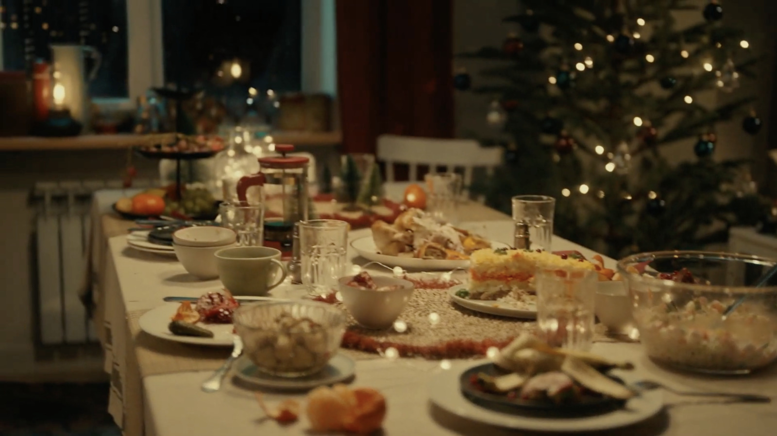 a table is set for a christmas dinner