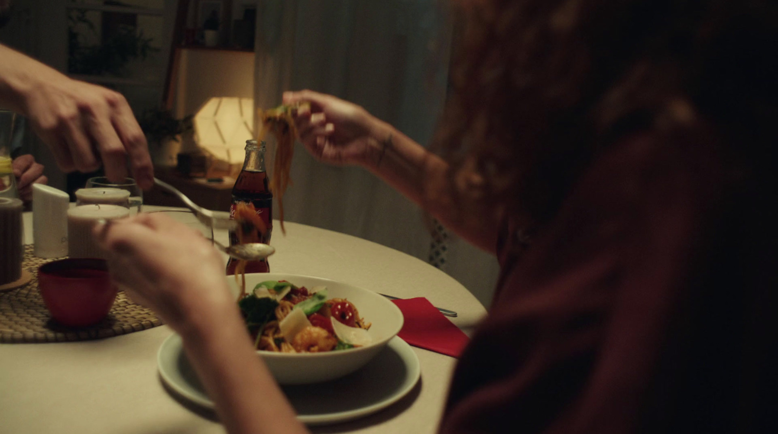 a woman is eating a meal at a table