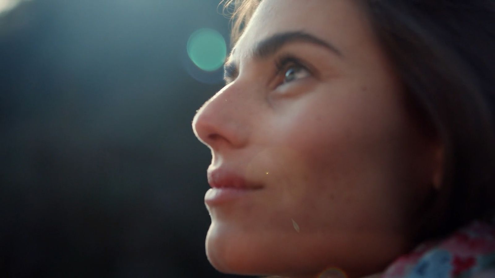 a close up of a woman's face with a blurry background