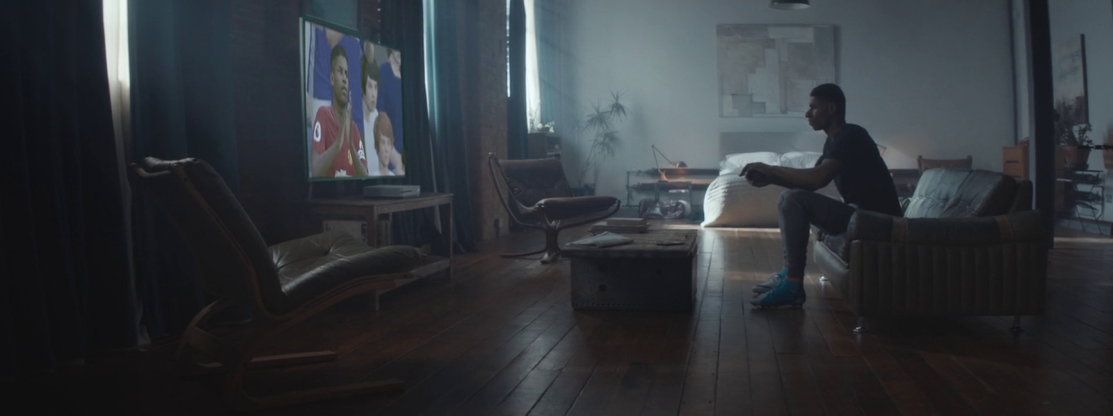 a man sitting on a couch in a living room