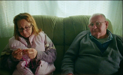 a man and a woman sitting on a couch