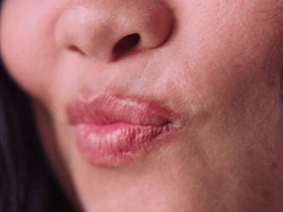 a close up of a woman's lips and nose