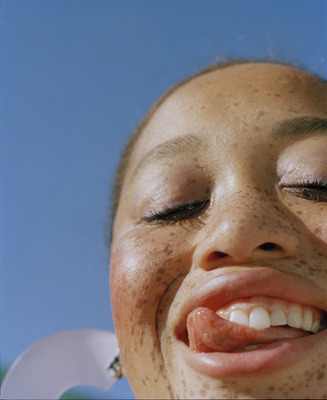 a close up of a person with freckles on her face