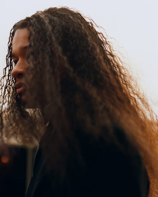 a close up of a person with long hair