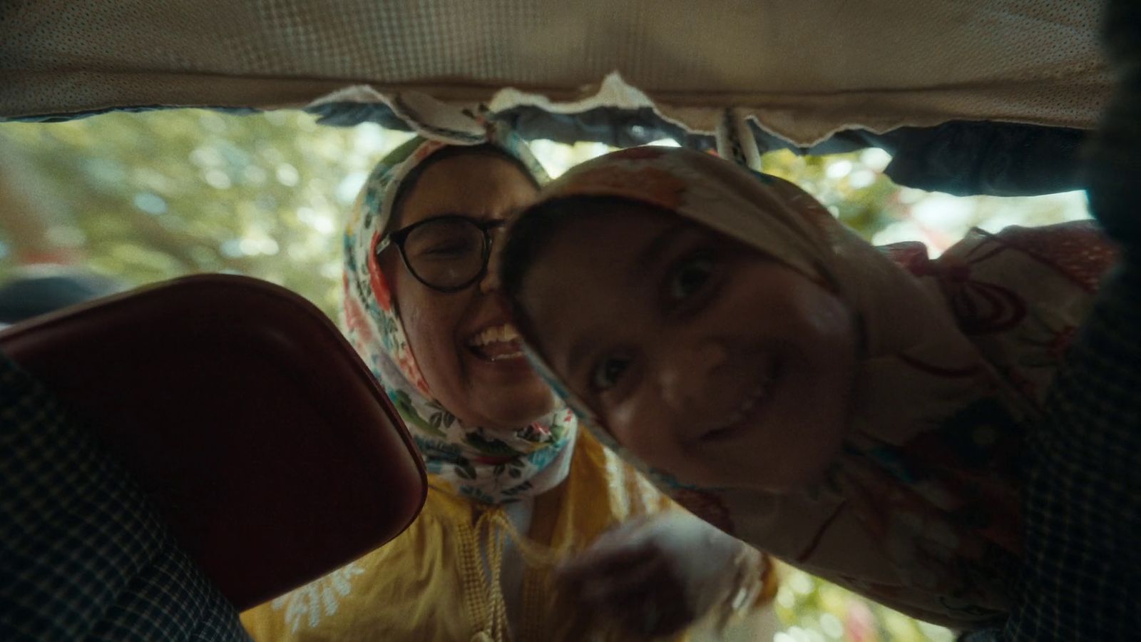 a couple of women sitting next to each other