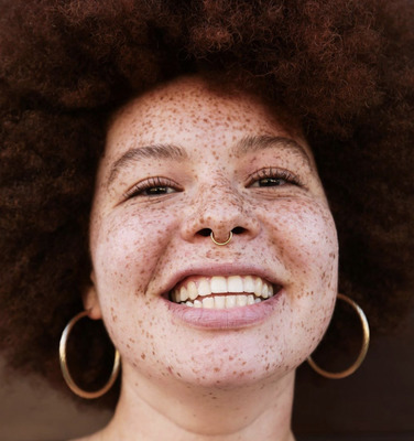 a close up of a person with freckles on her face