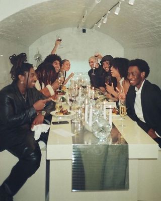 a group of people sitting around a dinner table