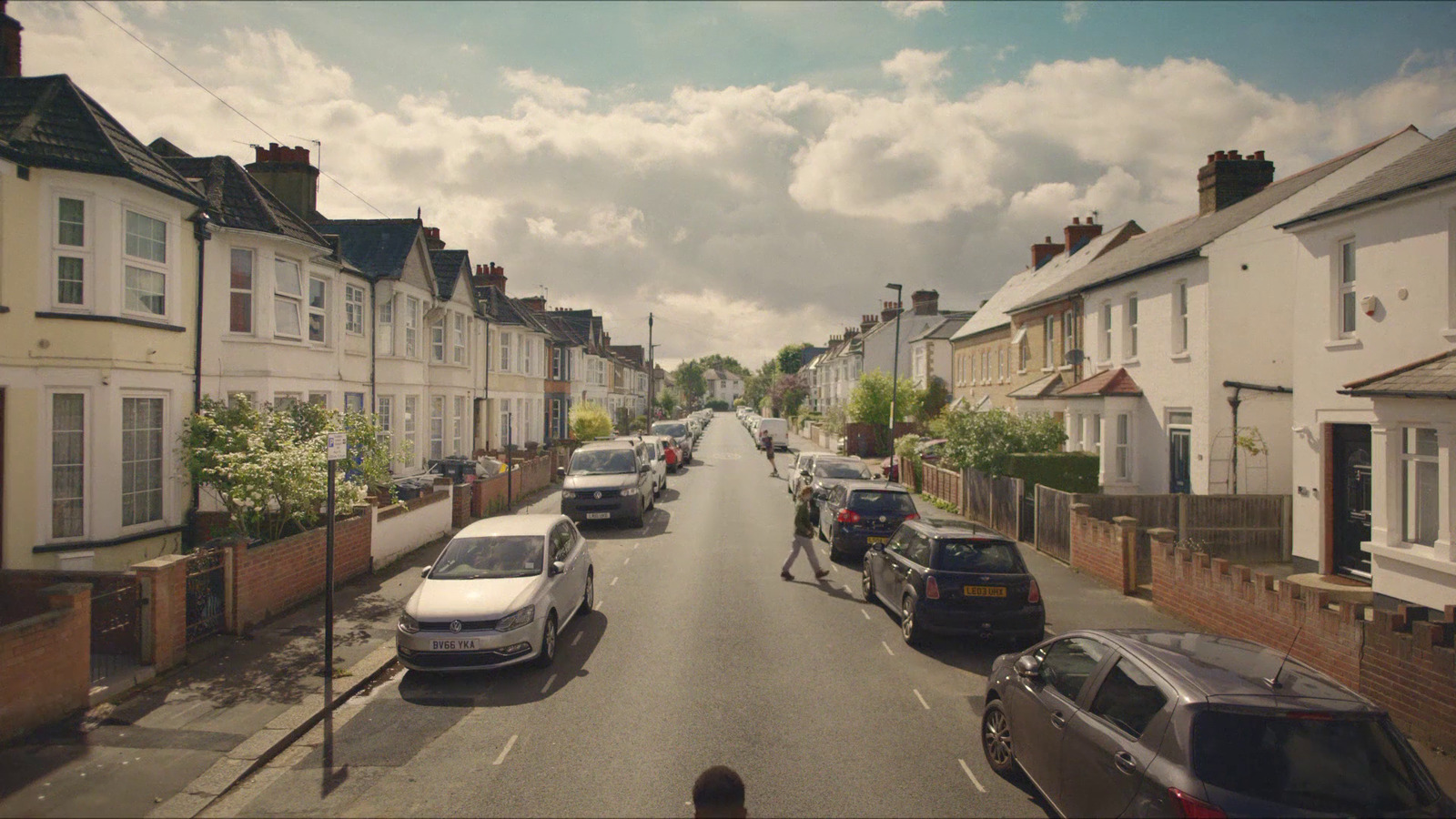 a street with cars parked on both sides of it