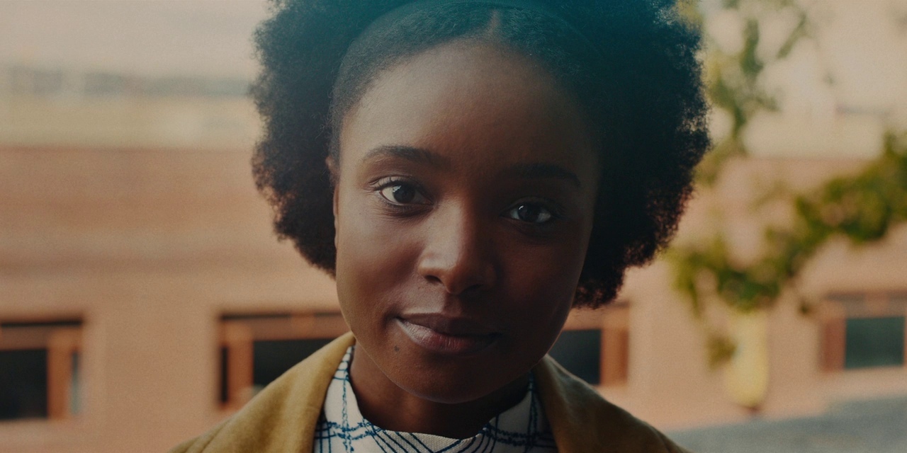 a close up of a person wearing a yellow jacket