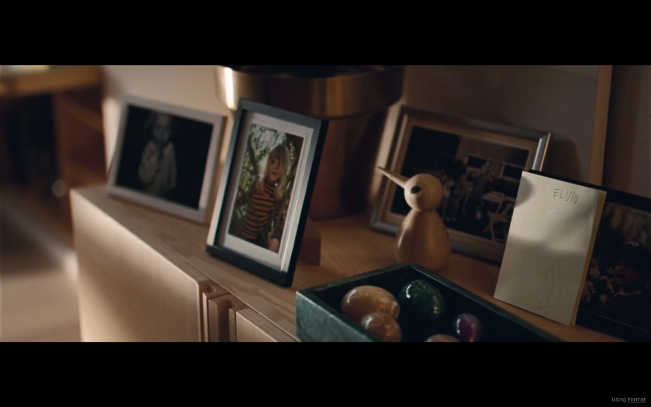 a wooden table topped with pictures and pictures