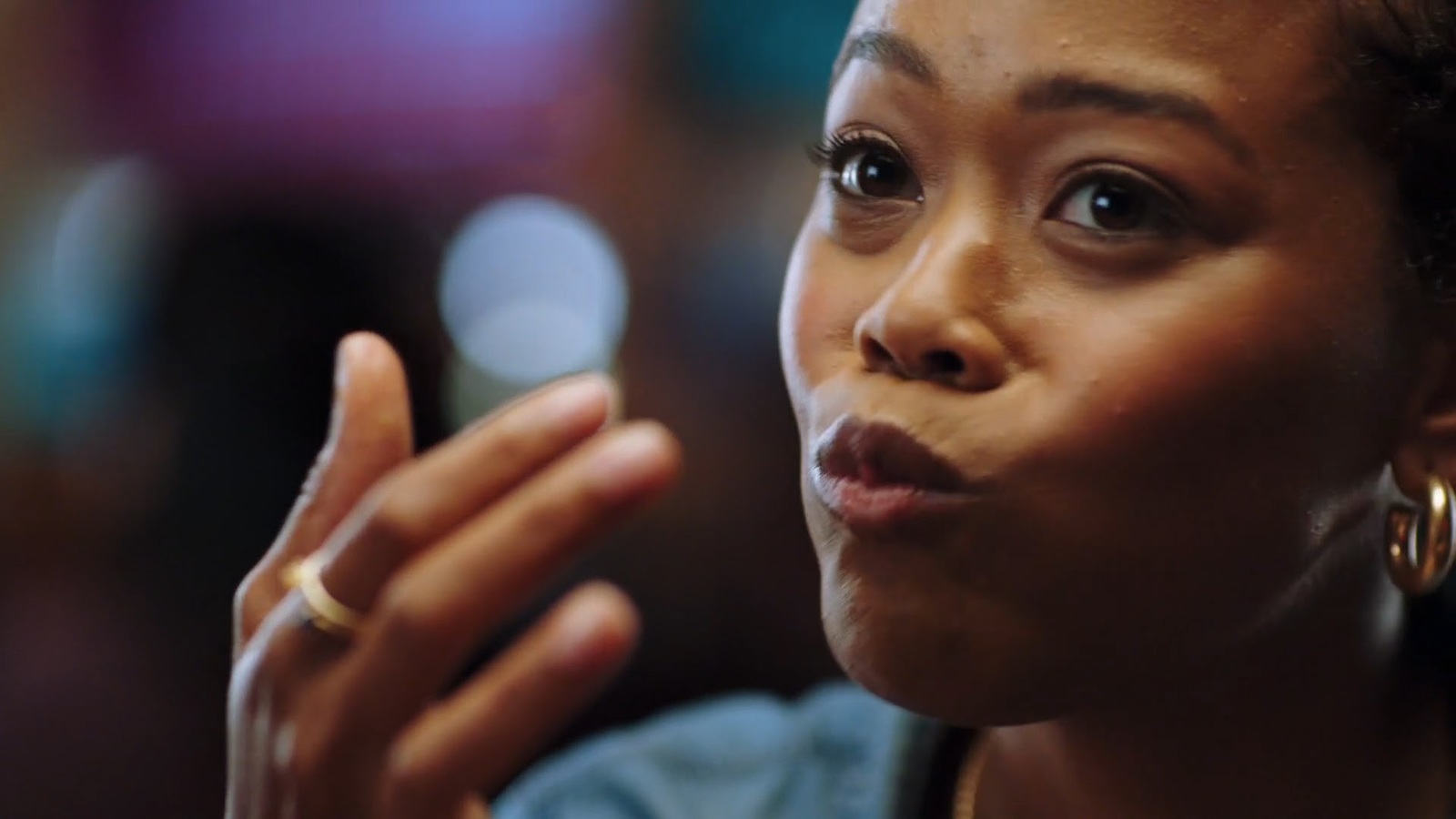 a close up of a person with a ring on her finger