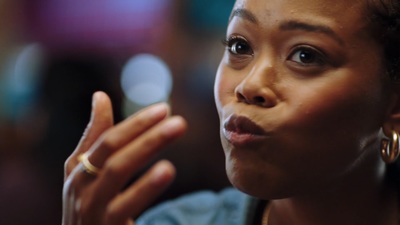 a close up of a person with a ring on her finger