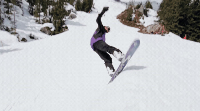 a person on a snowboard in the snow