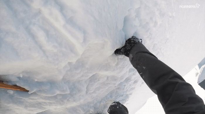 a person standing in the snow with their feet in the snow