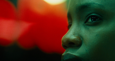 a close up of a woman's face with a blurry background